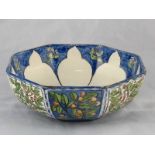 A Wedgwood Arts and Crafts ceramic octagonal nut bowl, the panels painted with nuts and berries,