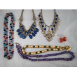 A mixed lot comprising five necklaces and a pair of earrings.