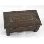 A copper Arts and Crafts tobacco box on four feet with embossed Tudor roses and hammered finish