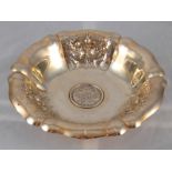 An Austrian silver, 800 grade, lobed bowl on stand embossed with floral panels,