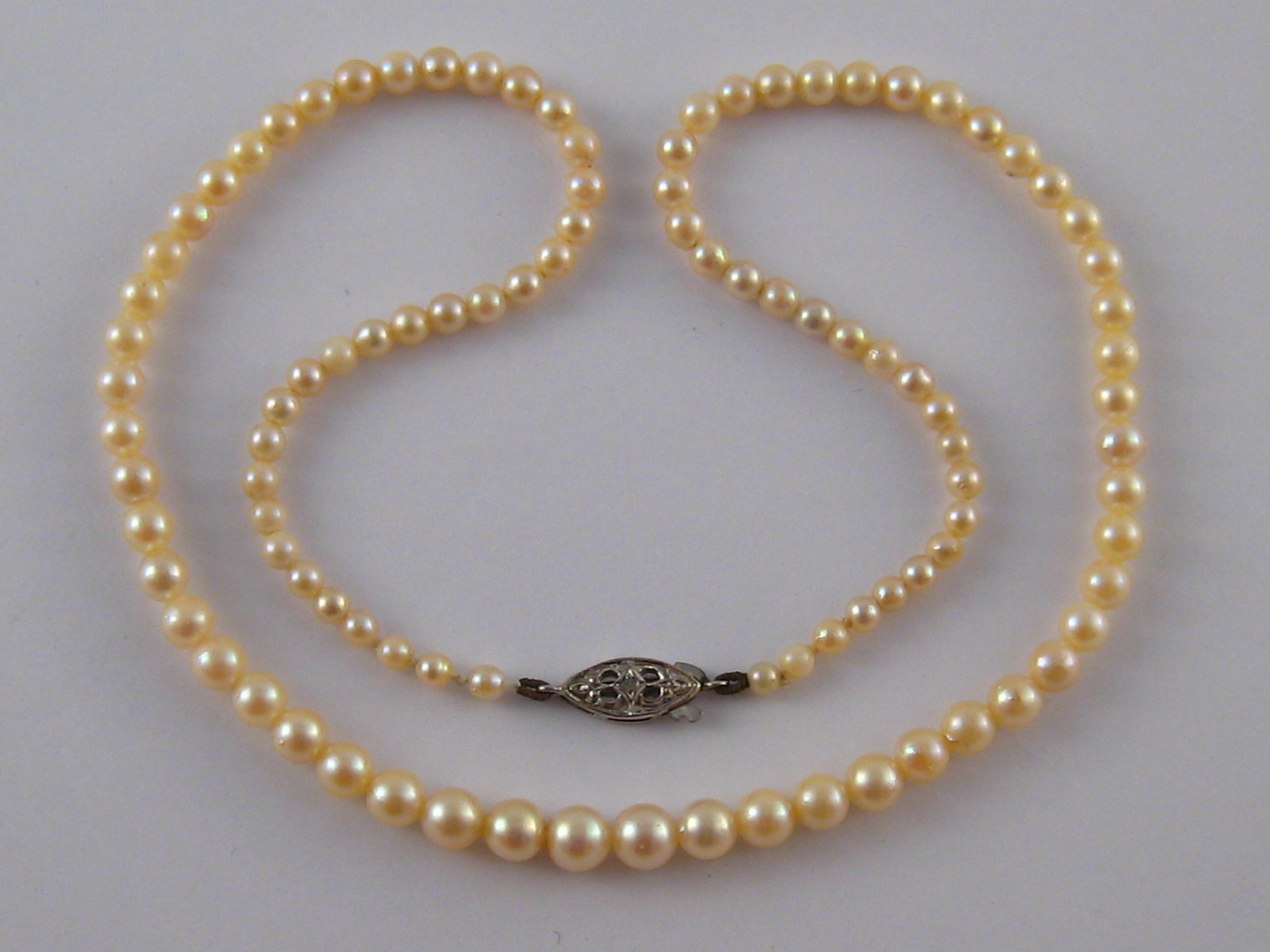 A graduated cultured pearl necklace, pearls between approx 3.2 - 5.8mm, 43cm long.