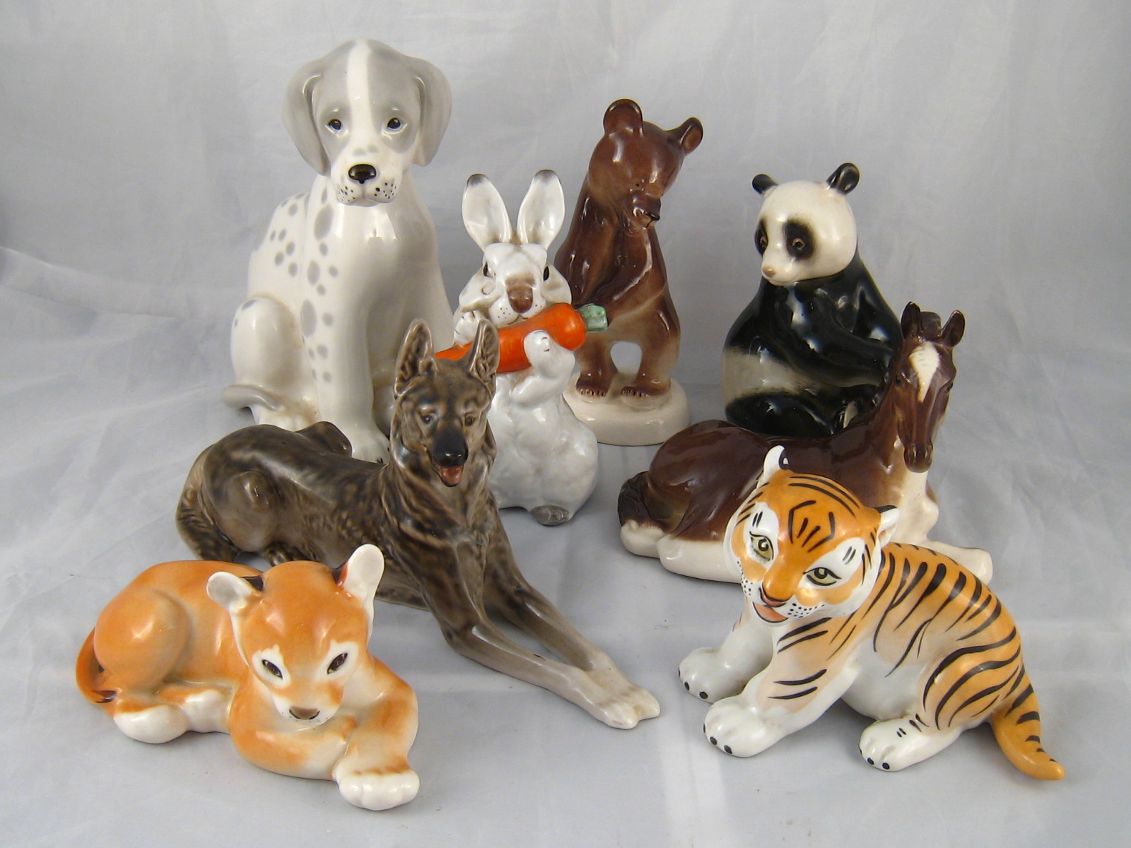 A group of eight Soviet ceramic animal figures by Lomonosov, comprising panda, rabbit,