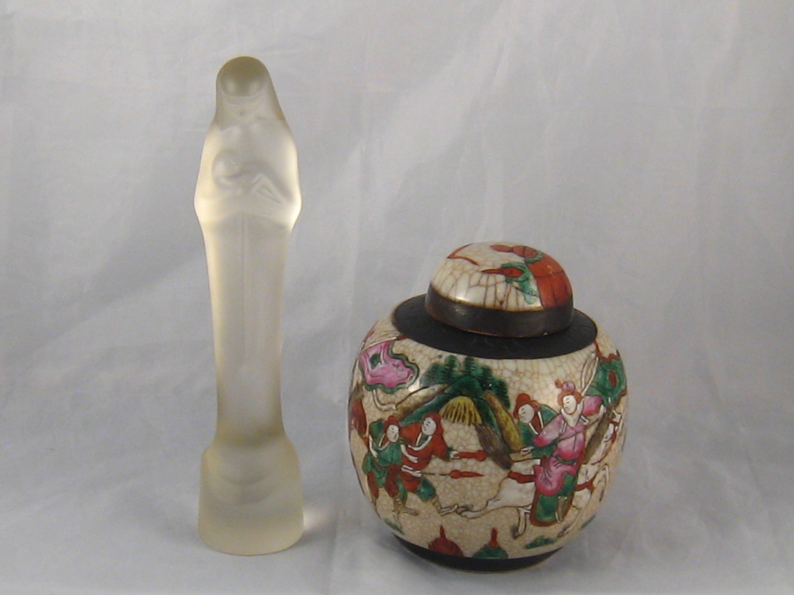 A Japanese ginger jar and cover with warring figures , seal mark to base. 13cm. diameter, ht.