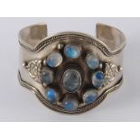 A white metal (tests silver) moonstone cuff bracelet, approx 5cm wide, 59 gms.