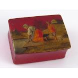 An early 20th. century Russian lacquer stamp box, the lid with a woman washing clothes in the river.
