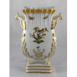 A large two handled rectangular baluster vase on scroll feet decorated with birds and butterflies.