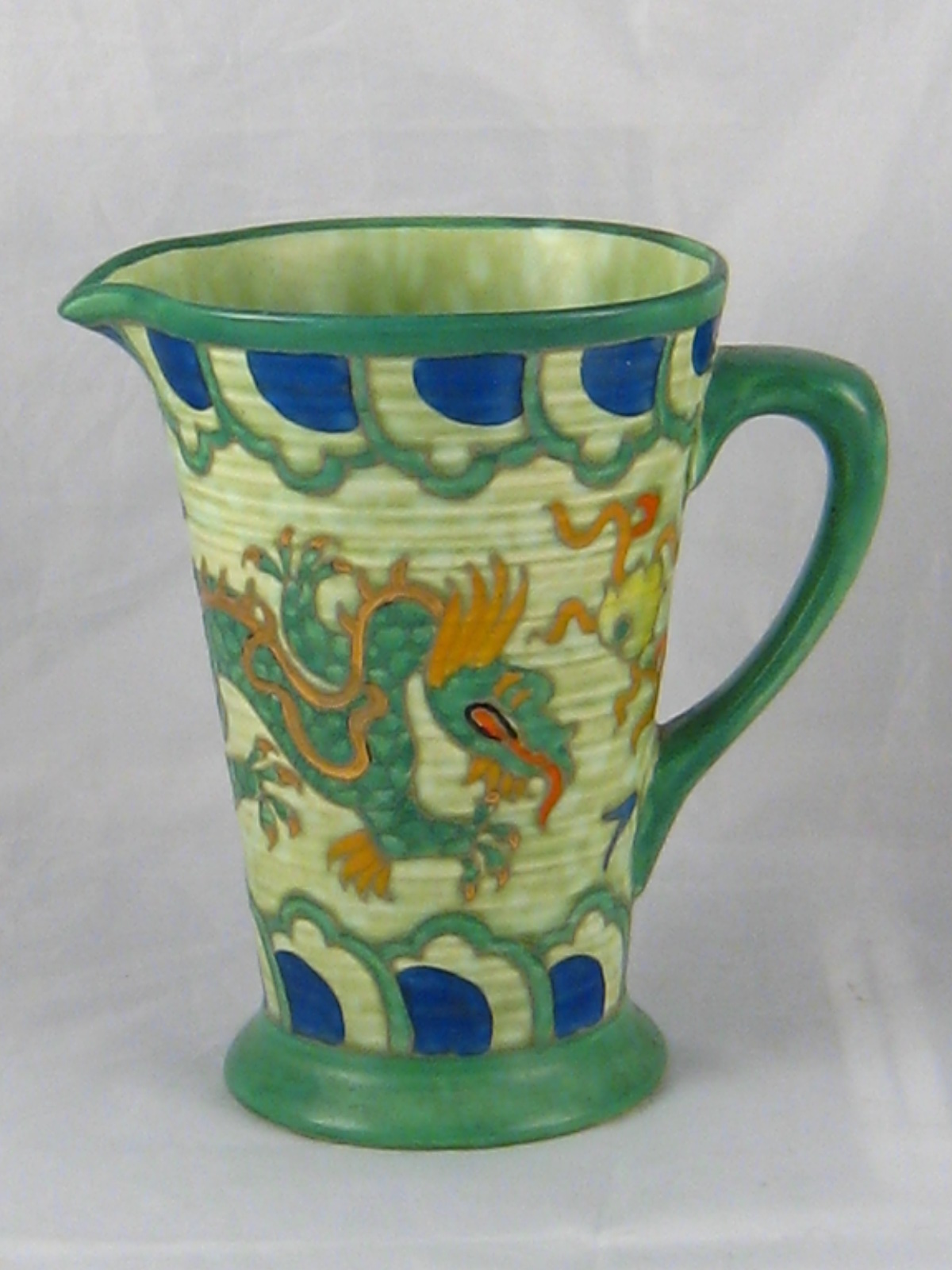 Charlotte Rhead. A Manchu pattern jug with C.