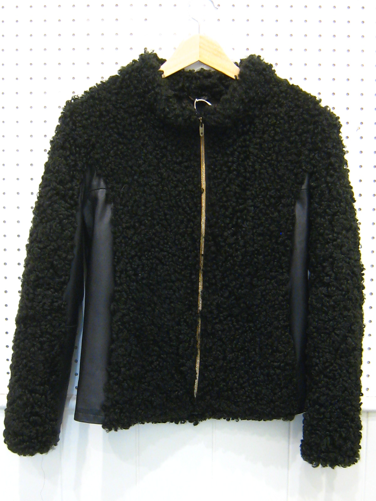 A lamb wool and leather jacket, size small, some wear to sleeve lining.