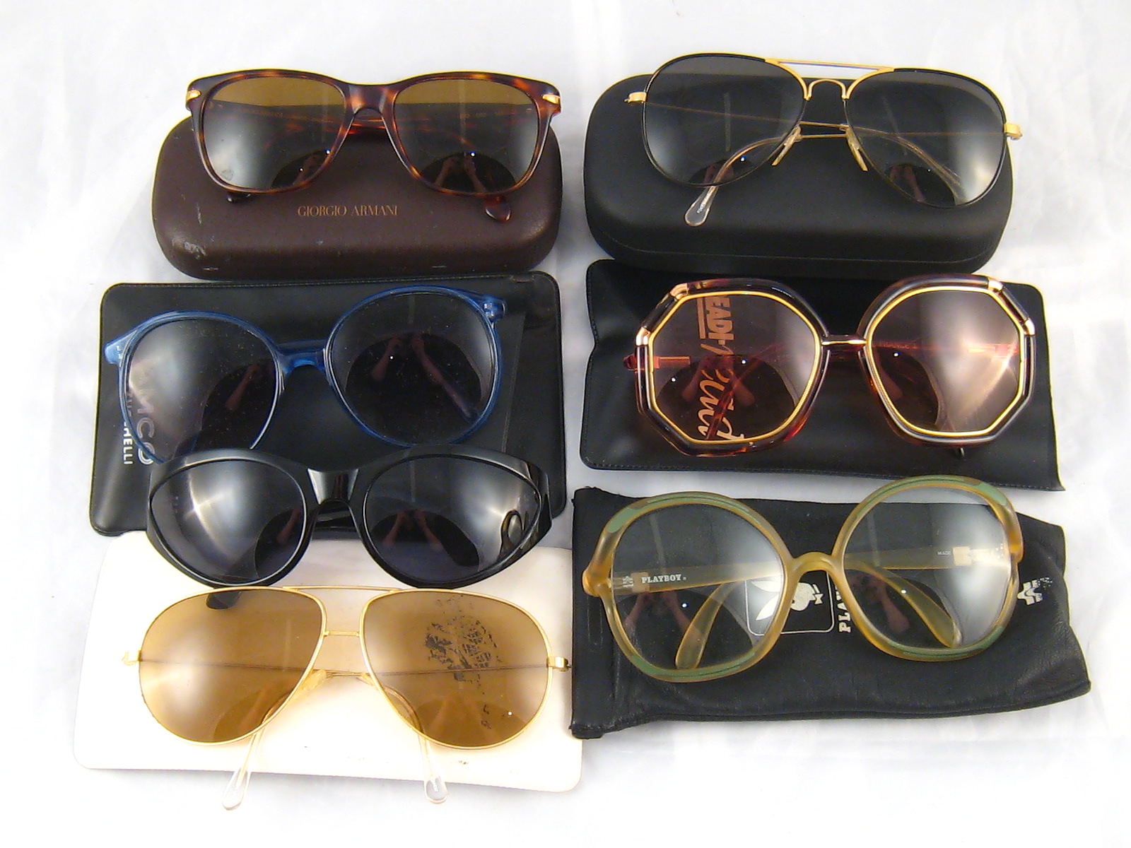 Seven pairs of designer sunglasses, including examples by Versace,