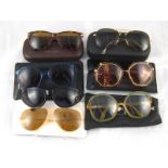 Seven pairs of designer sunglasses, including examples by Versace,