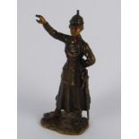 A cold painted Austrian bronze figure of a woman officer wearing a pickelhalb helmet,