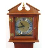 A mahogany "grandmother" clock with broken arch pediment, the 20cm.