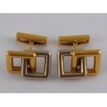A pair of French hallmarked 18 carat yellow and white gold cufflinks by Fred Paris, signed Fred,