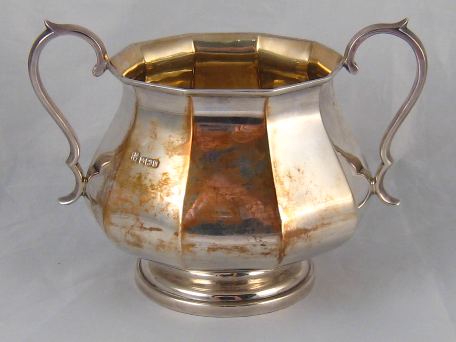 A silver two handled panelled baluster sugar bowl by Fordham and Faulkner, Sheffield, 1912. Wt.