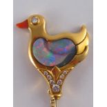 A fine 18 carat gold brooch designed as a duck with an opal body and coral beak,