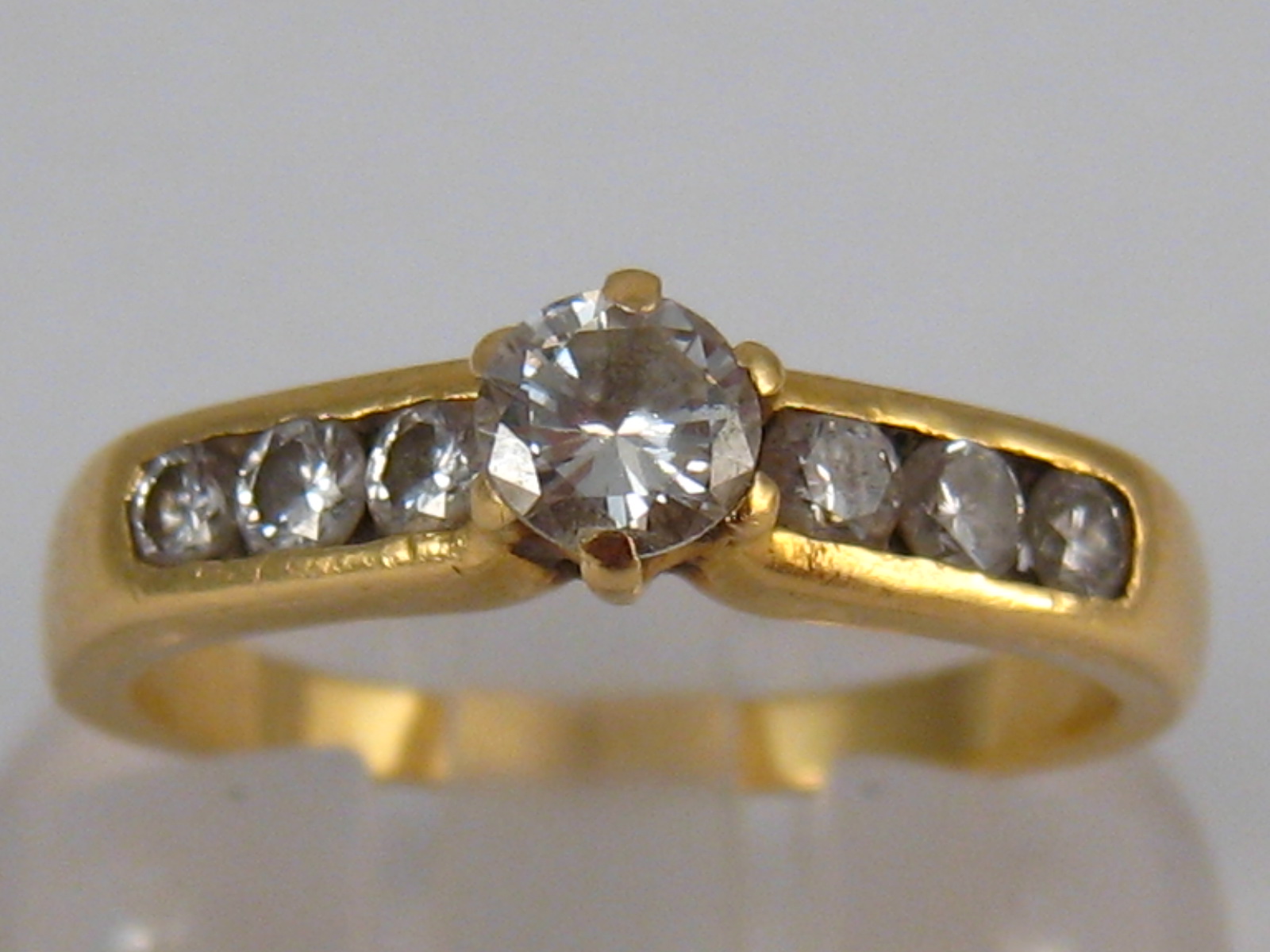 A yellow metal (tests 18 carat gold) diamond ring,