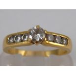 A yellow metal (tests 18 carat gold) diamond ring,