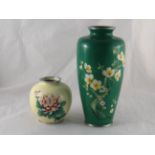 A 1920s Japanese cloisonne vase with chrysanthemum flower and bud inset in the cream body, ht.12cm.