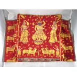 A pair of Indian temple hangings gold painted on coarse russet cloth with linings.