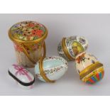A Limoges miniature box together with an enamel pot pourri basket and three enamel Easter eggs,