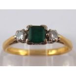 A yellow metal (tests 18 carat gold) emerald and diamond ring, emerald approx 4x4mm,