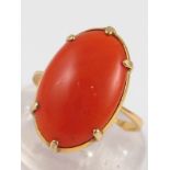 A yellow metal (tests 18 carat gold) coral ring, the coral of good colour measuring approx 16.