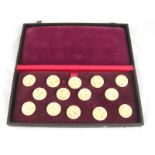 A set of twelve carved ivory buttons with screwed stud fixings in fitted box, circa 1920.