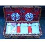 An unused comprehensive wicket hamper picnic set for six marketed by Asprey, containing plates,