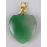 A jade heart pendant with a yellow metal (tests 14 carat gold) fitting, heart approx 23mm wide, 5.