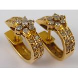 A pair of yellow metal (tests 18 carat gold) diamond earrings, approx 2cm, 4.9 gms.