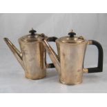 A pair of Art Deco silver hot milk or water jugs by S. Blankensee & Sons, Birmingham 1934. ht.16cm.