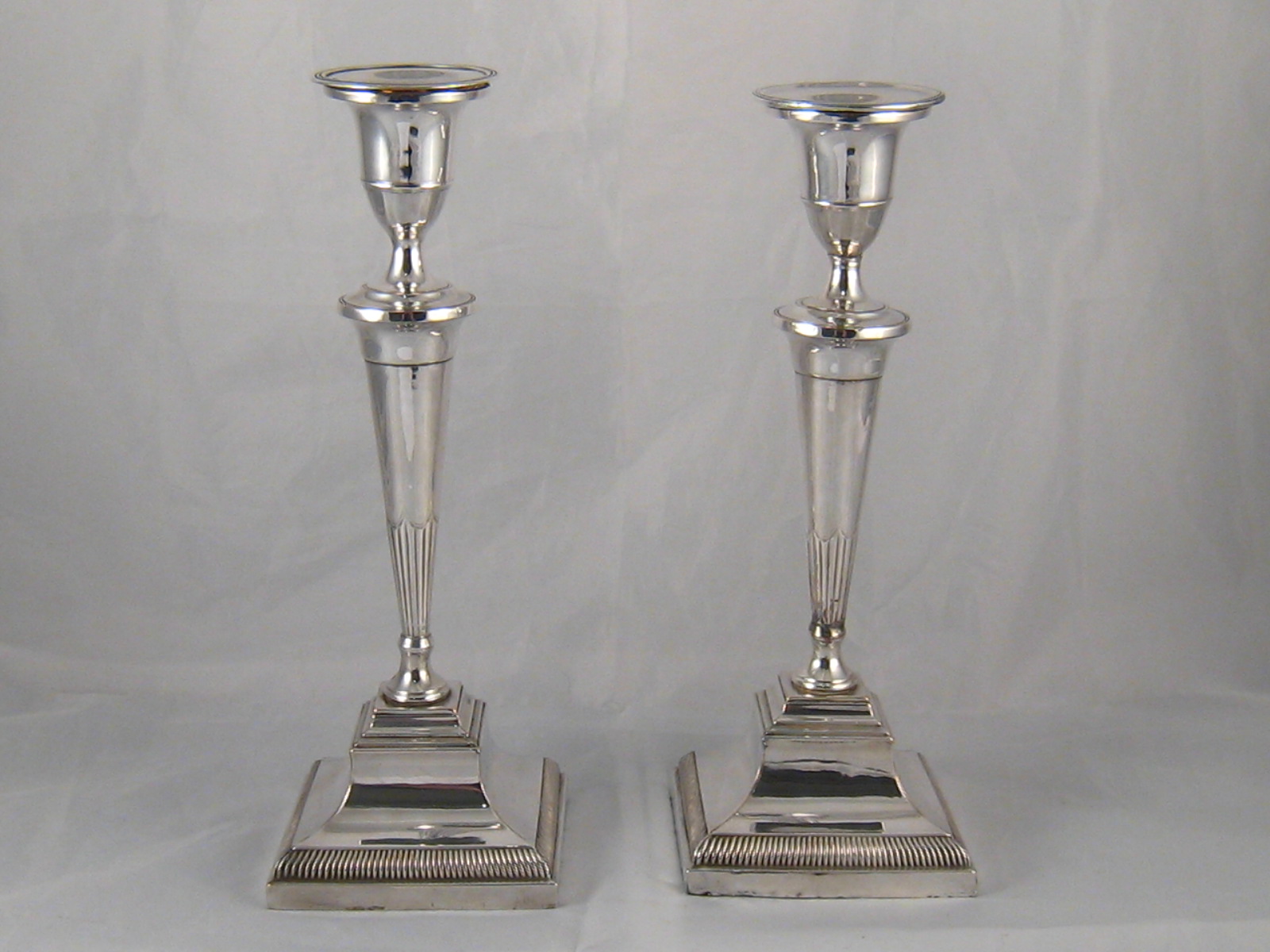 A pair of Georgian Sheffield plate candlesticks ,