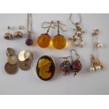 A mixed lot comprising a white metal (tests silver) amethyst pendant with matching earrings,