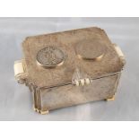 An Art Deco silver casket with ivory handles and feet,