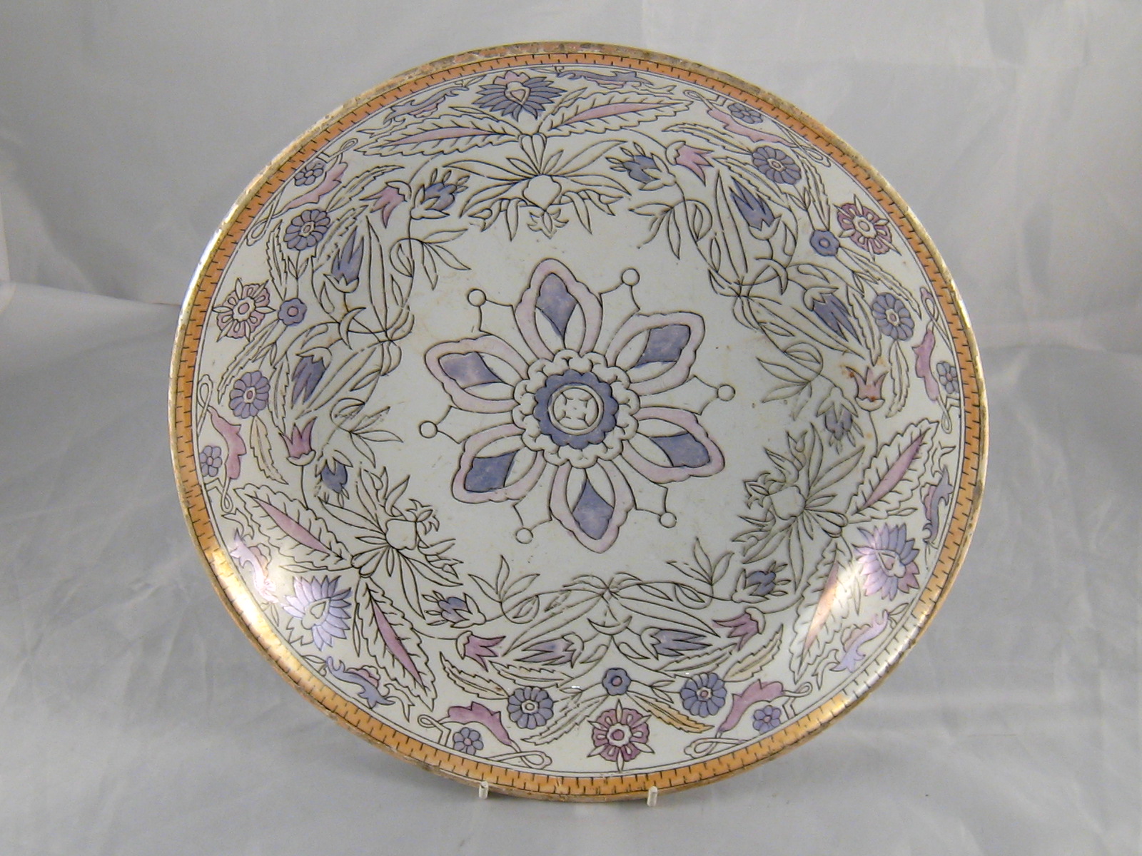 A Russian ceramic bowl with grey lustre highlights,