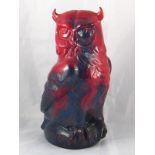 A Doulton ceramic owl with mottled red flambe glaze,