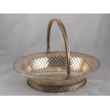 A fine George II pierced silver cake basket with rope twist rim, central armorials,