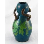 A West Country studio pottery dark green double gourd shaped vase with brown triple scroll handles,