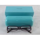 A pair of Tiffany spectacles, unused with clear lenses complete with case,