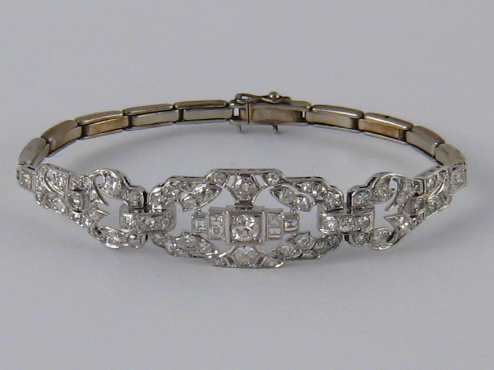 A white metal (tests 18 carat gold and platinum) diamond bracelet, numbered 648,