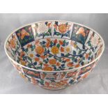 A large Chinese ceramic bowl with butterflies and floral decoration in overglaze enamels.