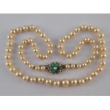A graduated cultured pearl necklace with a yellow metal (tests 9 carat gold) turquoise and seed