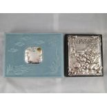 A silver faced cookery book and a silver faced album, both unused.