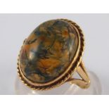 A 9 carat gold moss agate ring, agate approx 16 x 12.5mm, ring size J, 4.2 gms.