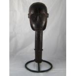 Tribal Art . A Fang tribe reliquary head mounted on an iron stand. Ht. 47cm.
