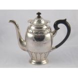 A Danish silver coffee pot, the oval bellied body with stiff acanthus embossed base and lid,