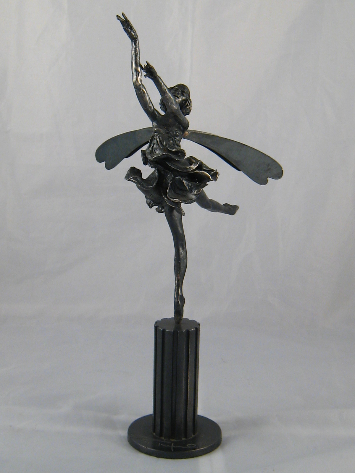 Tom Merrifield. "Dragonfly" A winged bronze figure of a dancer performing as a dragonfly.