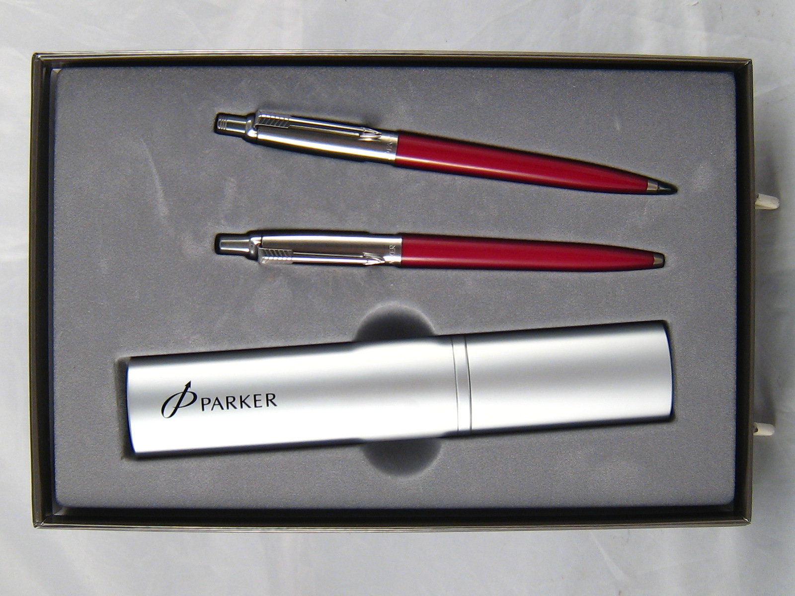 A Parker ball point and propelling pencil with oval cylindrical carrying case, in presentation box.