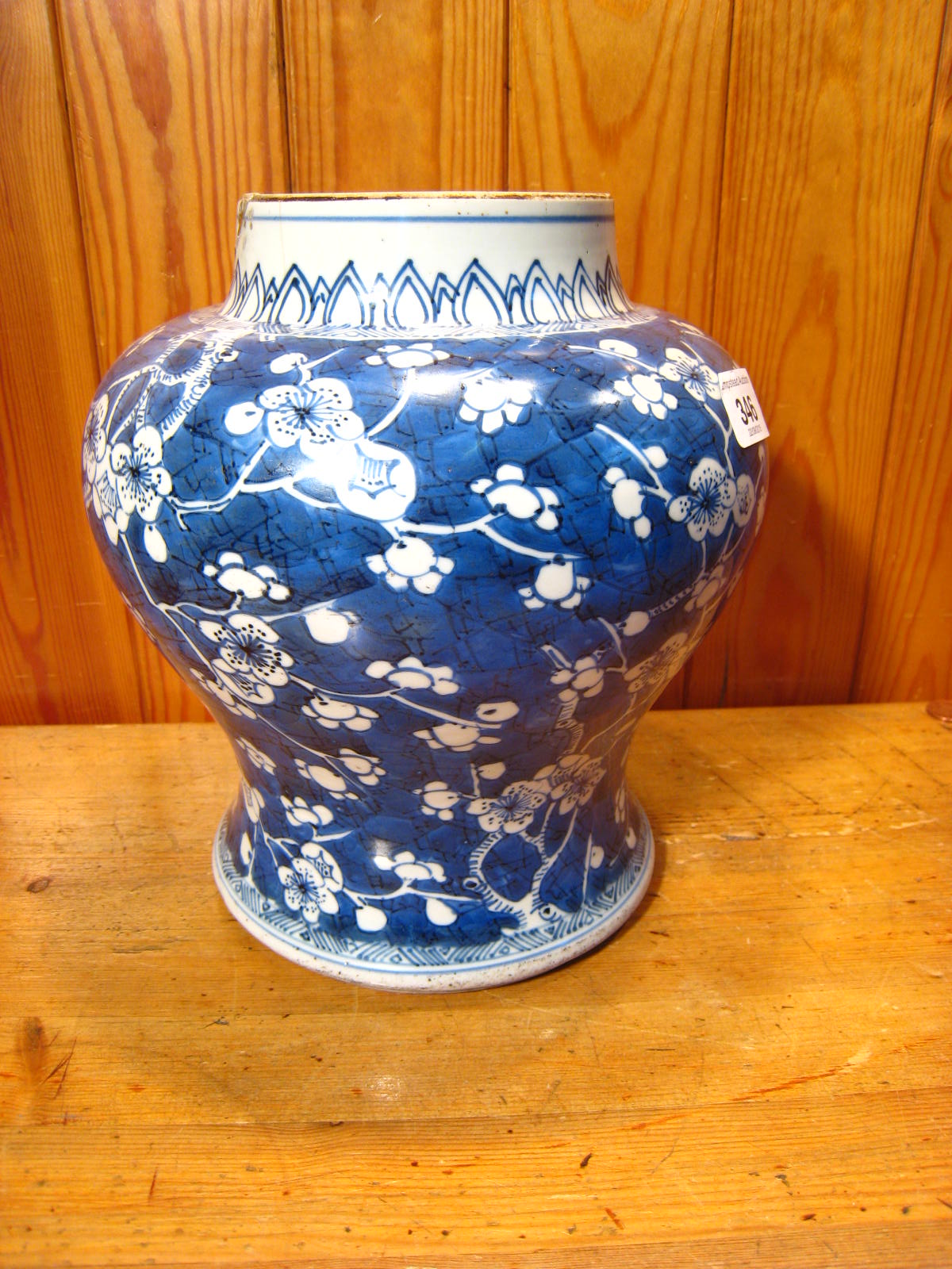 A Chinese squat baluster vase, circa 1700, with prunus on cracked ice. Repair to rim. 20cm. across. - Image 8 of 11