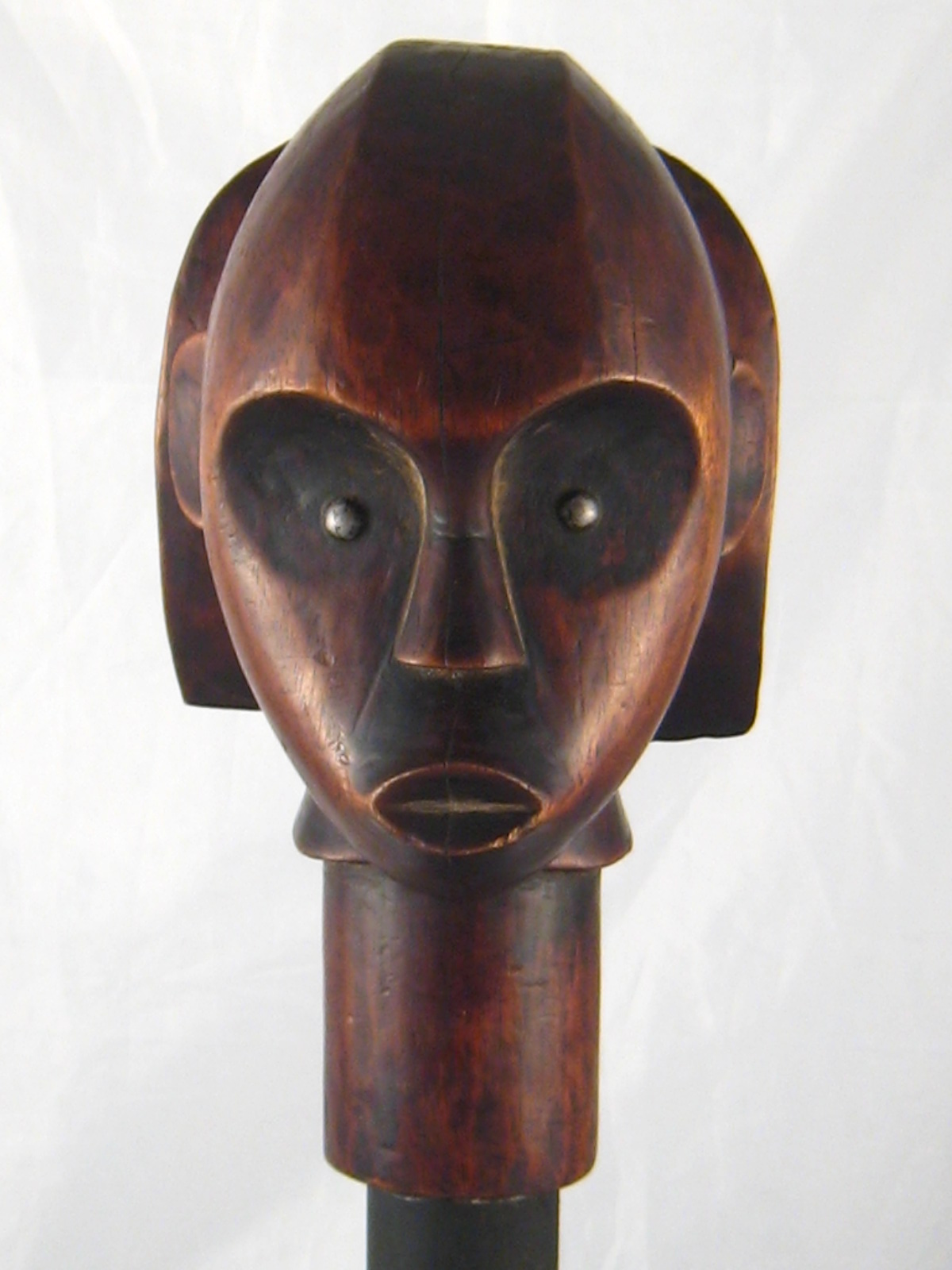 Tribal Art . A Fang tribe reliquary head mounted on an iron stand. Ht. 48cm.